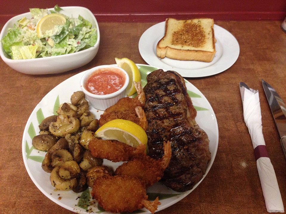 New York steak topped with jumbo shrimp
