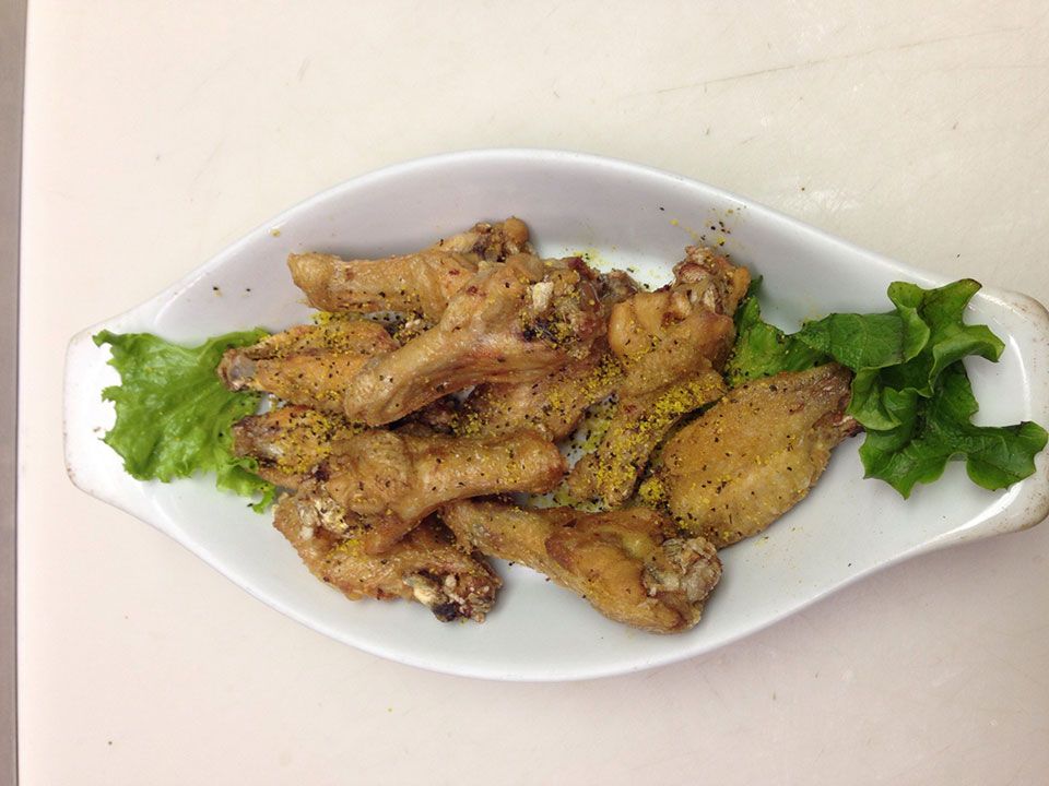 Plate of saucy chicken wings